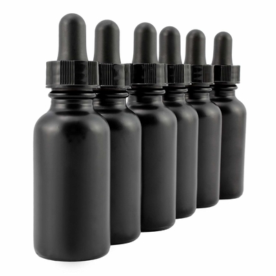 A garrafa de vidro preta do olho 30ml cosmético com conta-gotas derrama não